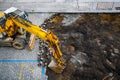 Excavator during the cobblestone street reconstruction Royalty Free Stock Photo