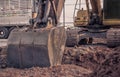 Excavator construction equipment park at worksite Royalty Free Stock Photo