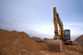 Excavator during construction of main water supply pipeline. Laying underground storm sewers at construction site. Water main Royalty Free Stock Photo