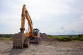 Construction digger excavator yellow hydraulic equipment trackhoe machine Royalty Free Stock Photo