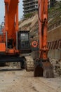 Excavator on construction site, Excavator Loader standing in sandpit with pulled down bucket Royalty Free Stock Photo