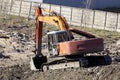 excavator on a construction site stands on the sand Royalty Free Stock Photo