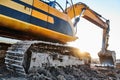 Excavation work. Excavator at construction site with sunset Royalty Free Stock Photo