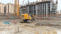 Excavator on a Construction Site Urban Development and New Building Project in Progress. Royalty Free Stock Photo