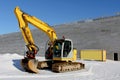 Excavator on a Construction Site in Winter Royalty Free Stock Photo