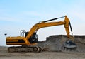 Excavator with crusher bucket for crushing concrete. Construction waste recycling for construction mix.