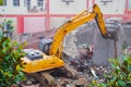 Excavator demolition house