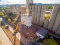 Excavator destroys an abandoned concrete elevator building in Kharkiv, Ukraine