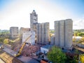 Excavator destroys an abandoned concrete elevator building in Kharkiv, Ukraine
