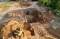 Excavator dig ground for sewerge construction. Trench for laying a concrete well ring and sewer pipe. Sewage drainage and concrete