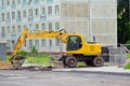 The excavator dig and repair road on the street. Royalty Free Stock Photo