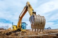 Excavator dig the trenches at a construction site. Trench for laying external sewer pipes. Sewage drainage system for a multi-