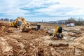 Excavator dig the trenches at a construction site. Trench for laying external sewer pipes. Sewage drainage system for a multi-