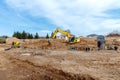 Excavator dig the trenches at a construction site. Trench for laying external sewer pipes. Sewage drainage system for a multi-