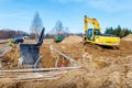 Excavator dig the trenches at a construction site. Trench for laying external sewer pipes. Sewage drainage system for a multi-