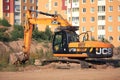 Excavator digger at a construction site. Construction machinery at the facility Royalty Free Stock Photo