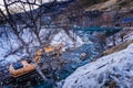 Excavator or digger in river deepening and cleaning riverbed