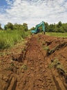 Excavator   are digging canalize the soil in the construction site. Royalty Free Stock Photo