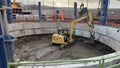 Excavator digging in circular construction pit in Ilkley, UK Royalty Free Stock Photo