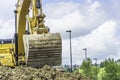 Excavator digging at contruction site for a new building Royalty Free Stock Photo