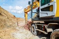 Excavator digging a hole. Earthwork Royalty Free Stock Photo
