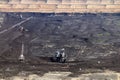 Excavator digging on open coal mine Royalty Free Stock Photo