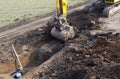 Excavator digging trench