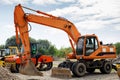 Excavator for digging trenches