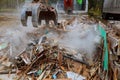 excavator disassembles broken house after tragedy Royalty Free Stock Photo