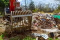 excavator disassembles broken house after tragedy Royalty Free Stock Photo