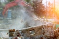 excavator disassembles broken house after tragedy Royalty Free Stock Photo