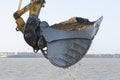 Excavator dredging a harbor Royalty Free Stock Photo