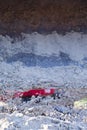 An excavator dropping sand during construction work