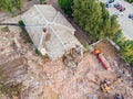 Excavator and dump truck working at the demolition of an old derelict building Royalty Free Stock Photo