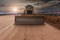 An excavator at the end of the day at the construction site of a road Royalty Free Stock Photo
