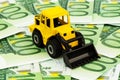 Excavator on euro banknotes Royalty Free Stock Photo