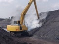 The excavator extinguish fires from coal spontaneous combustion