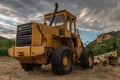 Excavator with grapple for transporting logs in a forestry operation