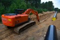 Excavator HITACHI ZAXIS 200 cl during earthwork for laying Crude oil and Natural gas pipeline in forest area. Installation