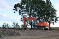 Excavator HITACHI ZAXIS 240LC working at construction site. Construction machinery for excavating,