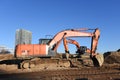 Excavator HITACHI ZAXIS 200 working at construction site. Construction machinery for excavating, loading, lifting and hauling of