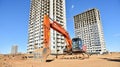 Excavator HITACHI ZAXIS 200 working at construction site. Construction machinery for excavating,