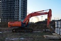 Excavator HITACHI ZAXIS 200 working at construction site. Construction machinery for excavating,