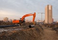 Excavator HITACHI ZAXIS 200 working at construction site. Construction machinery for excavating,