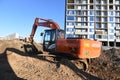 Excavator HITACHI ZAXIS 200 working at construction site.