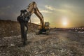 Excavator with hydraulic hammer on road construction works Royalty Free Stock Photo