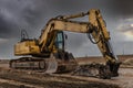 Excavator with hydraulic hammer on road construction works Royalty Free Stock Photo