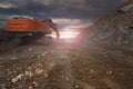 Excavator with hydraulic hammer on road construction works Royalty Free Stock Photo