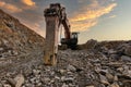 Excavator with hydraulic hammer on road construction works Royalty Free Stock Photo