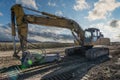 Excavator with hydraulic hammer on road construction works Royalty Free Stock Photo